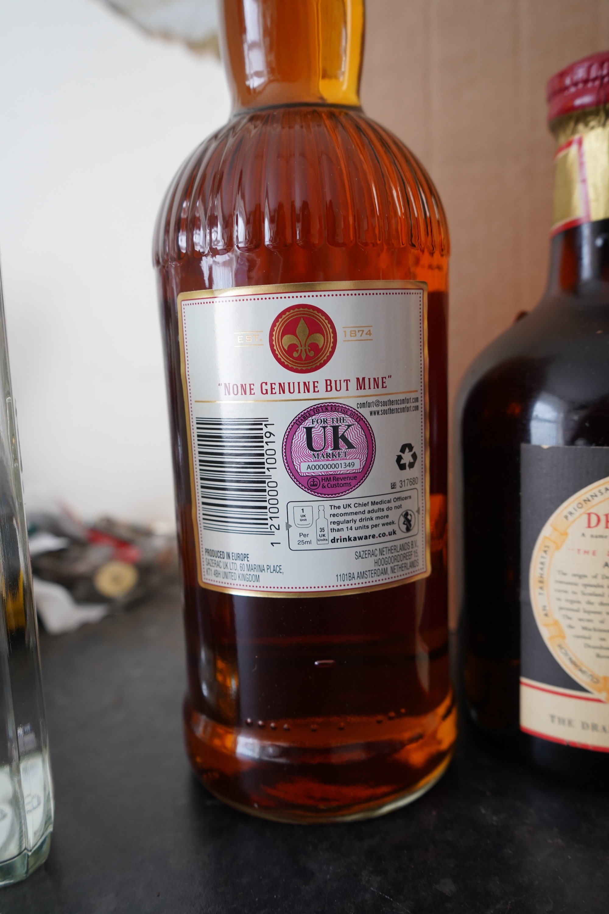 Six bottles of spirits and liqueurs, including whiskey and gin